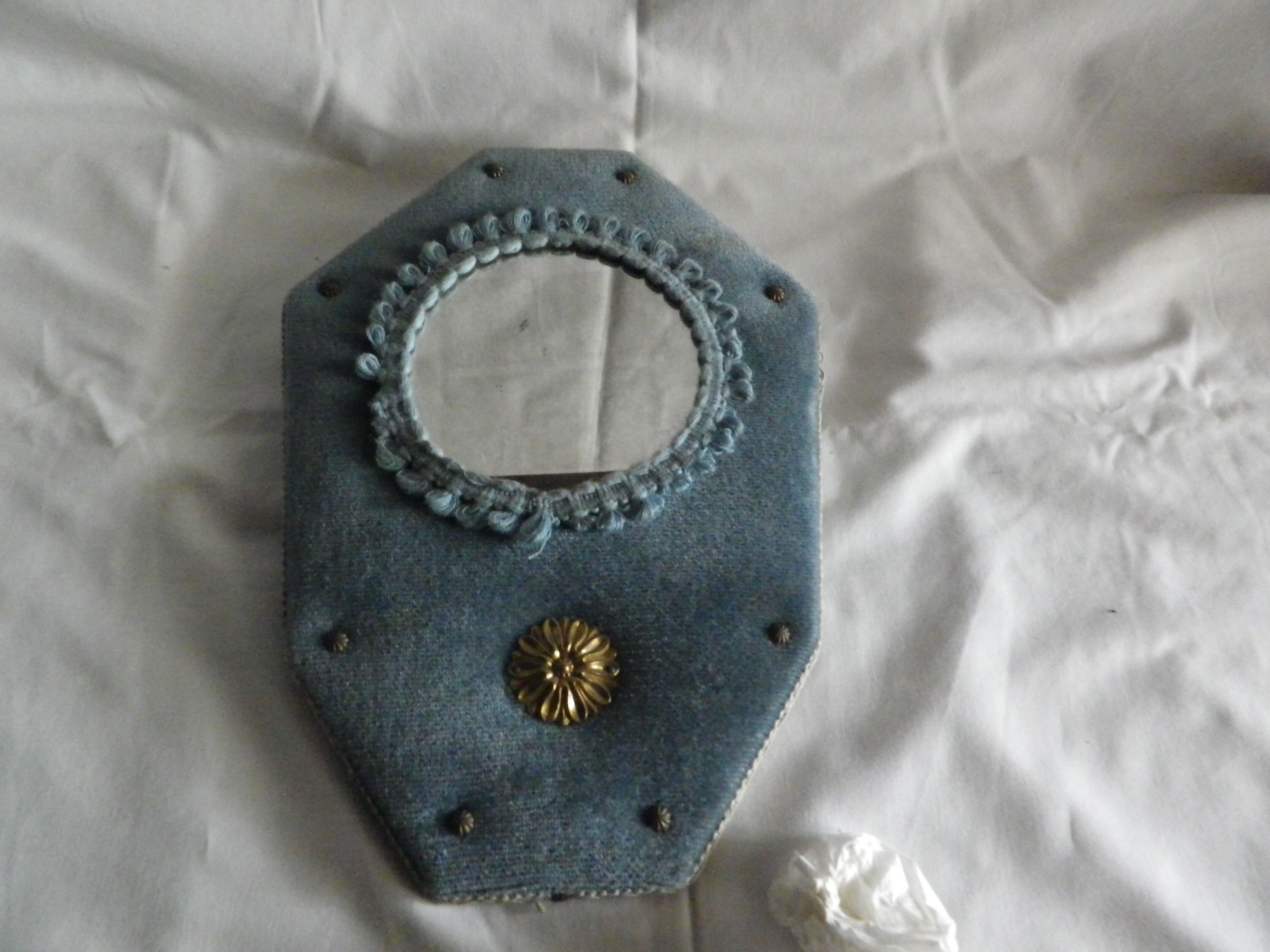 Mirror on blue velvet fabric