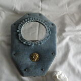 Mirror on blue velvet fabric