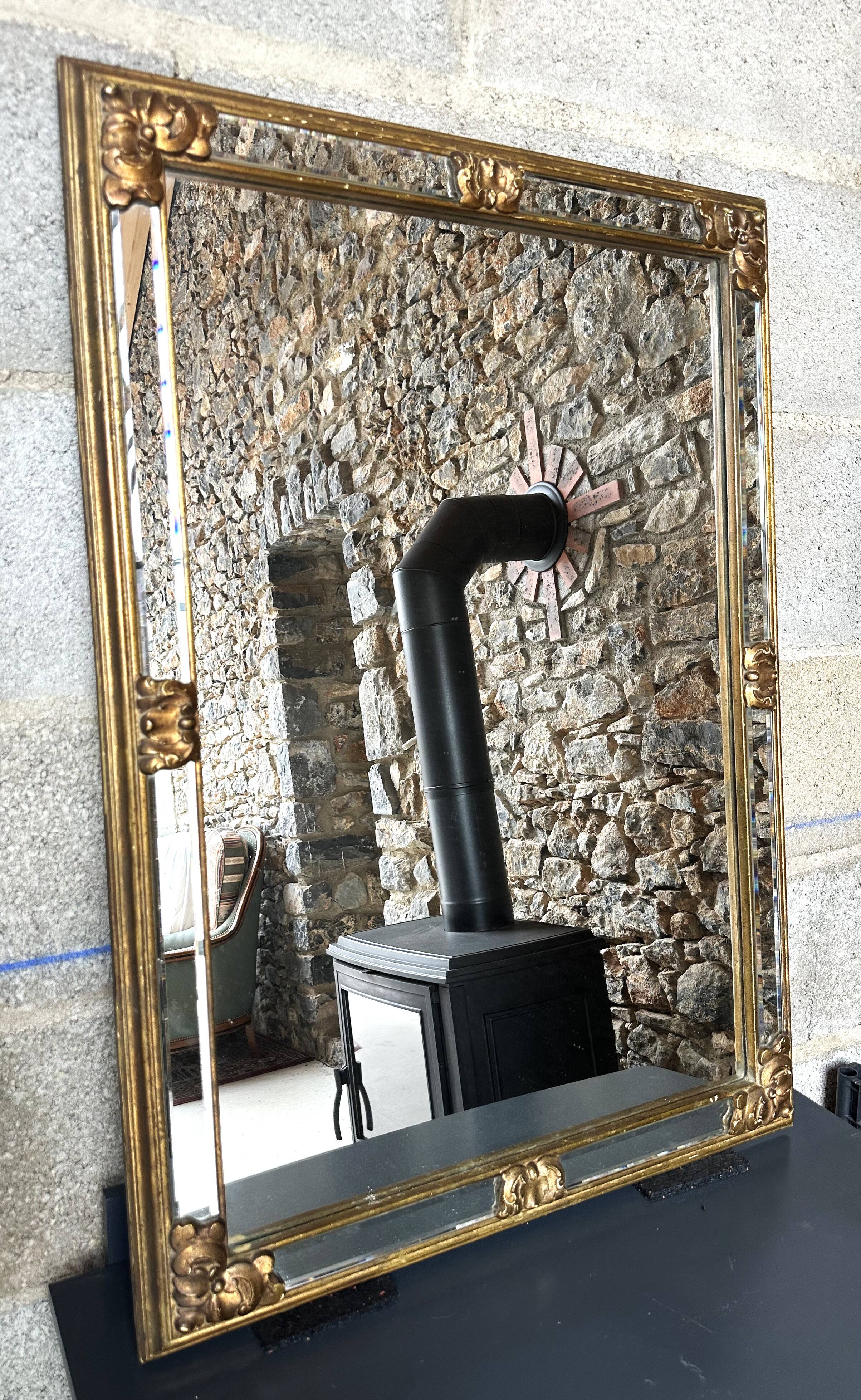 Bevelled gold Deknudt mirror with frames, Belgium, 20th century.