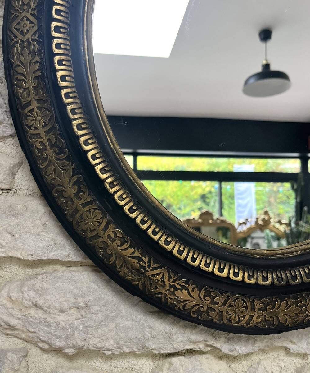 Miroir ancien 61,5/53,5cm ovale époque Napoléon III, noir et doré