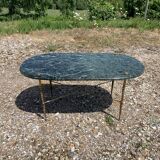 Oval coffee table in veined green marble
