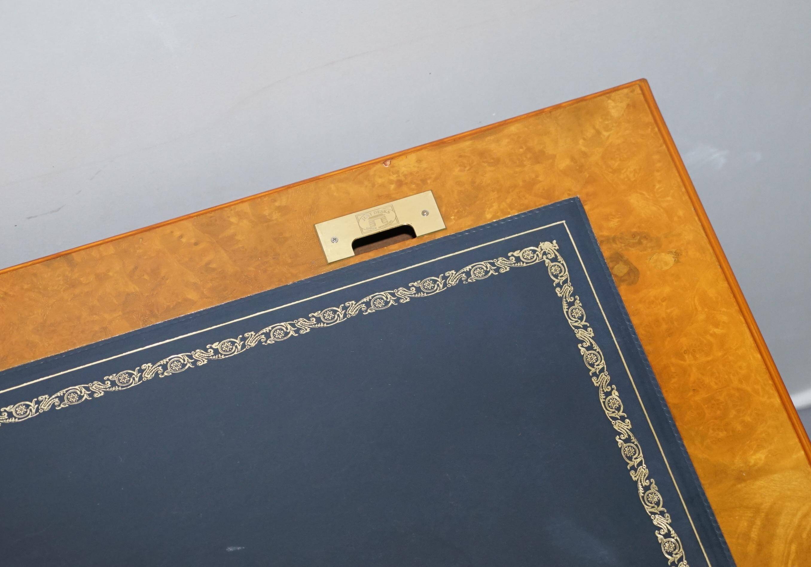 Partner desk in burr walnut designed to conceal computer equipment.