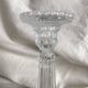Column candle holders in moulded glass made in France.
