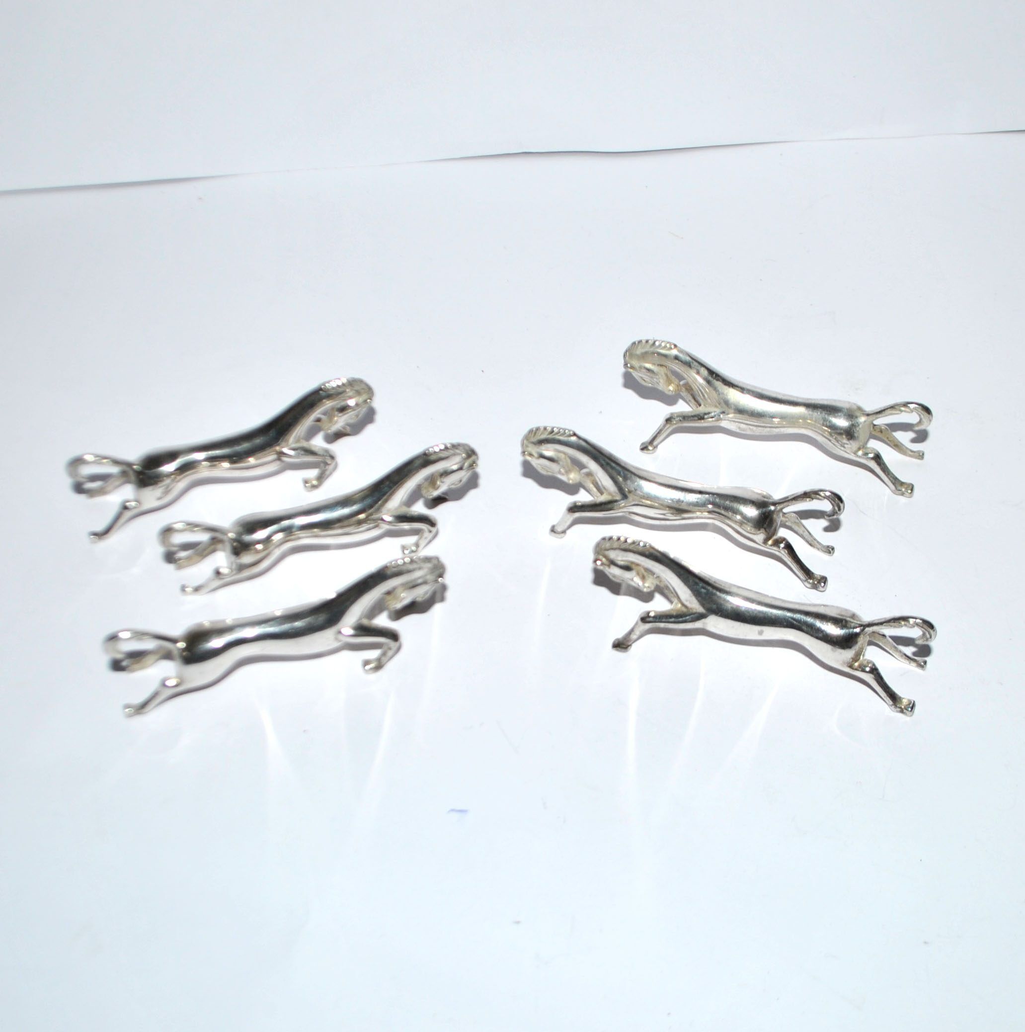 Set of 6 animal-shaped knife rests, modernist horse design in silver-plated metal, equestrian.