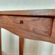 Small antique solid wood table in chic country style with a drawer.