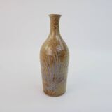 Brown ceramic/stoneware bottle with chiseled floral pattern