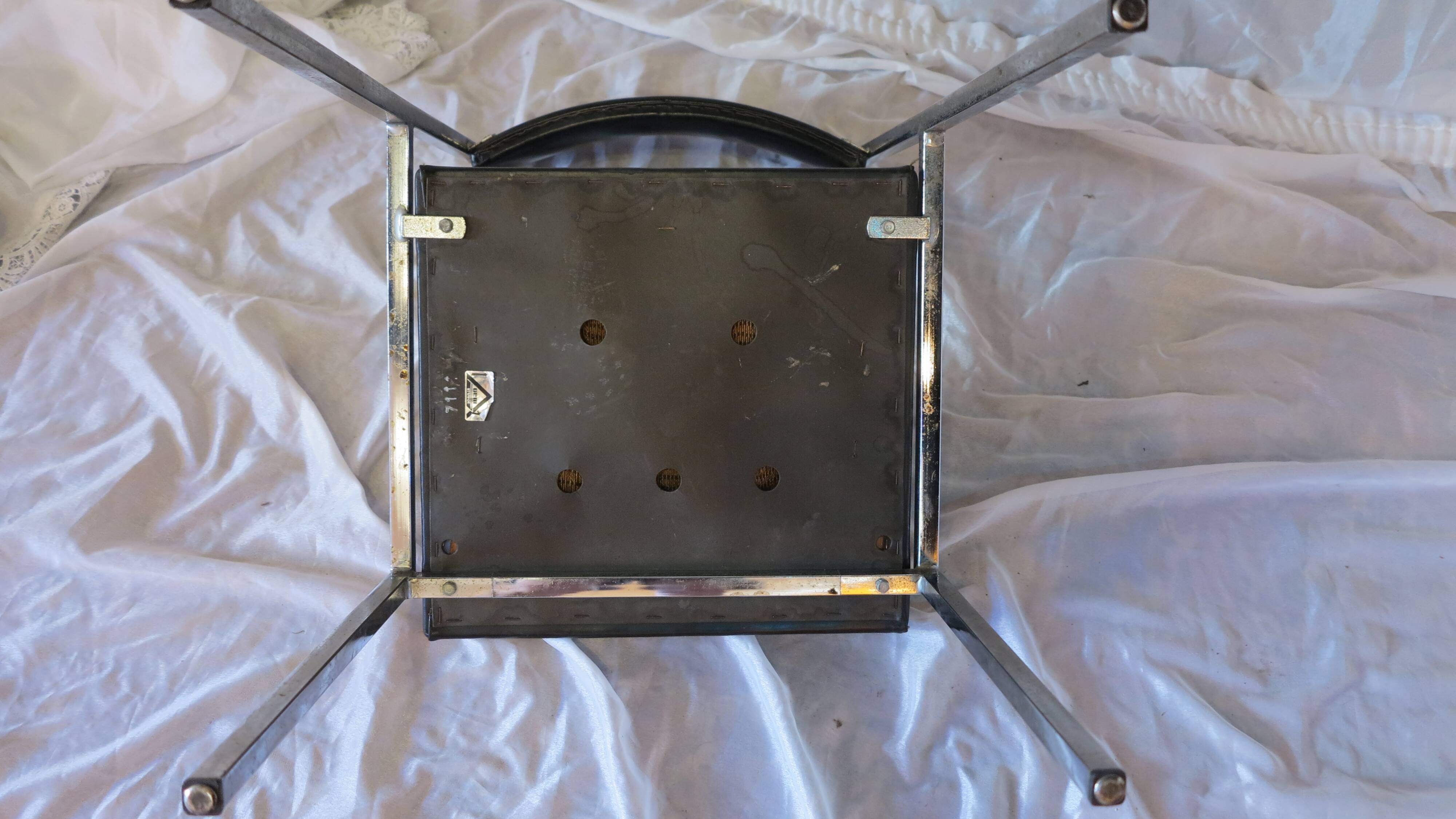 Modernist chair in chromed metal and black imitation leather