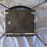 Modernist chair in chromed metal and black imitation leather