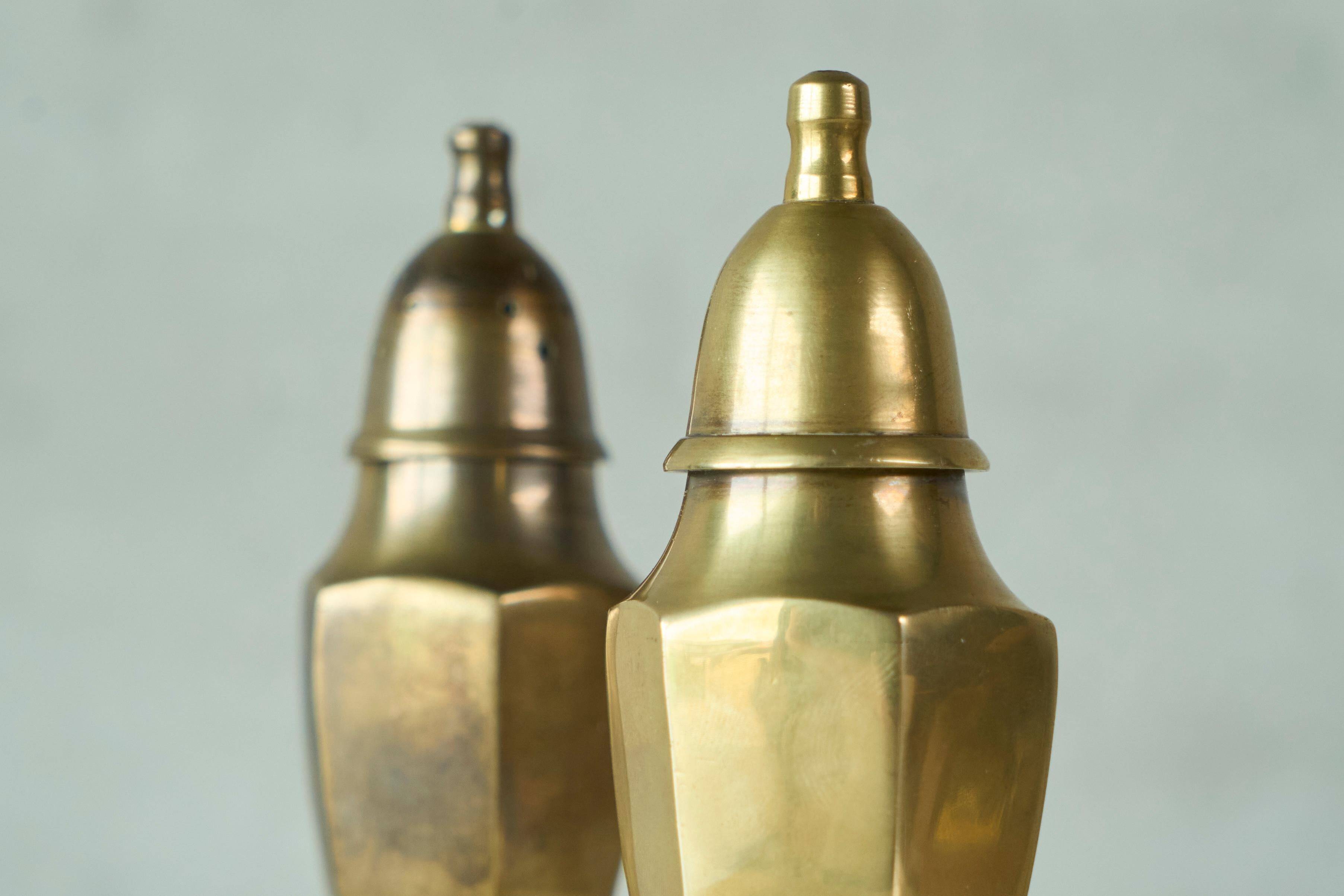 Pair of patinated brass salt and pepper shakers, 20th century.