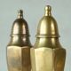 Pair of patinated brass salt and pepper shakers, 20th century.