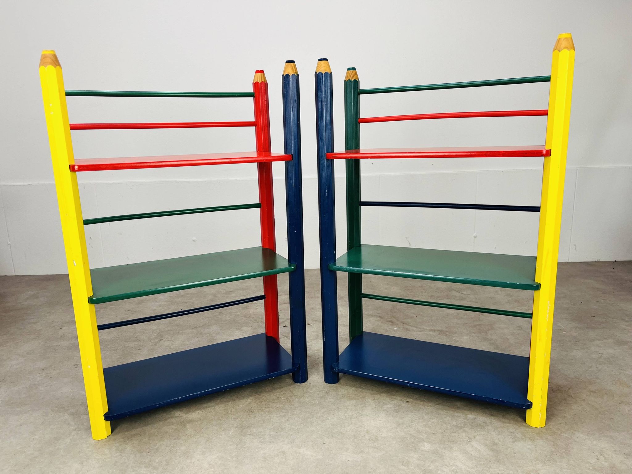 Pair of pencil-style shelves by Pierre Sala for children.
