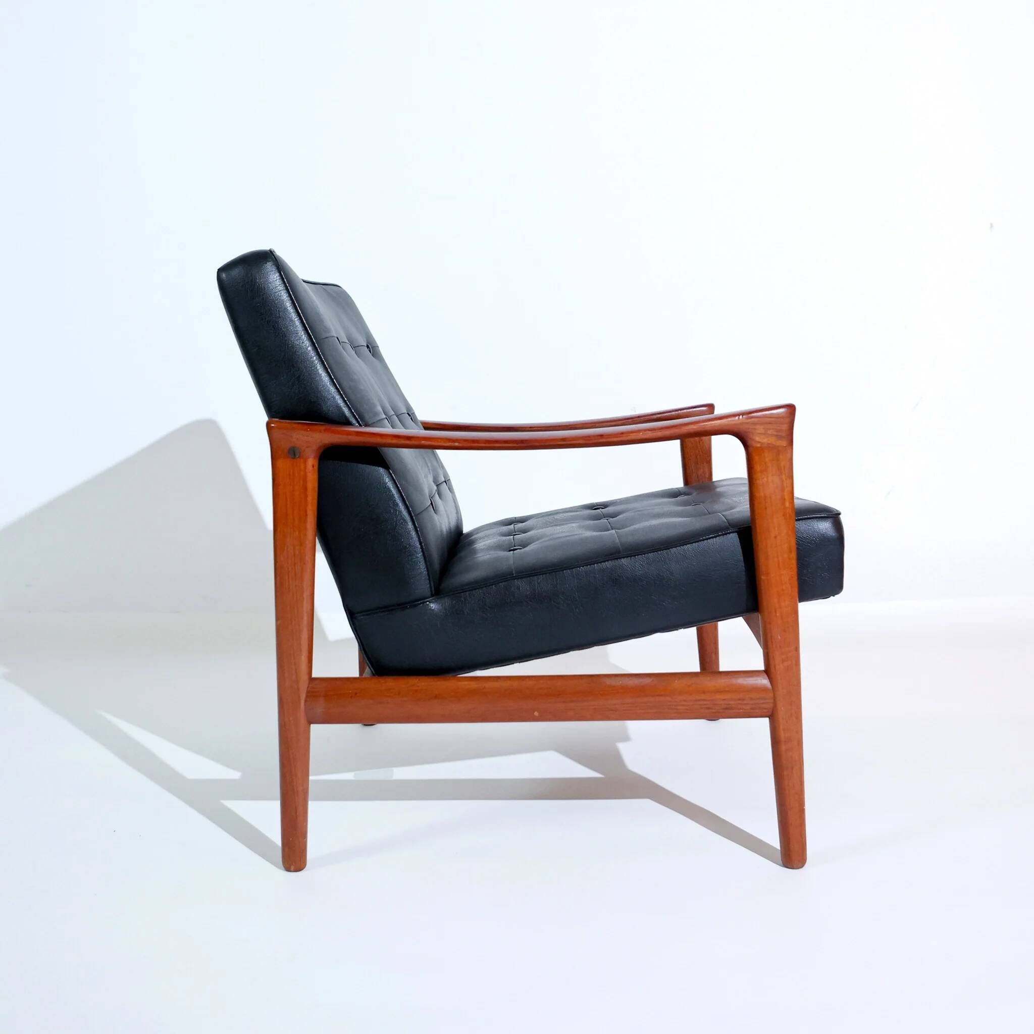 Vintage Scandinavian lounge chair by Bröderna Andersson, teak and black faux leather upholstery, 1950s-1960s.