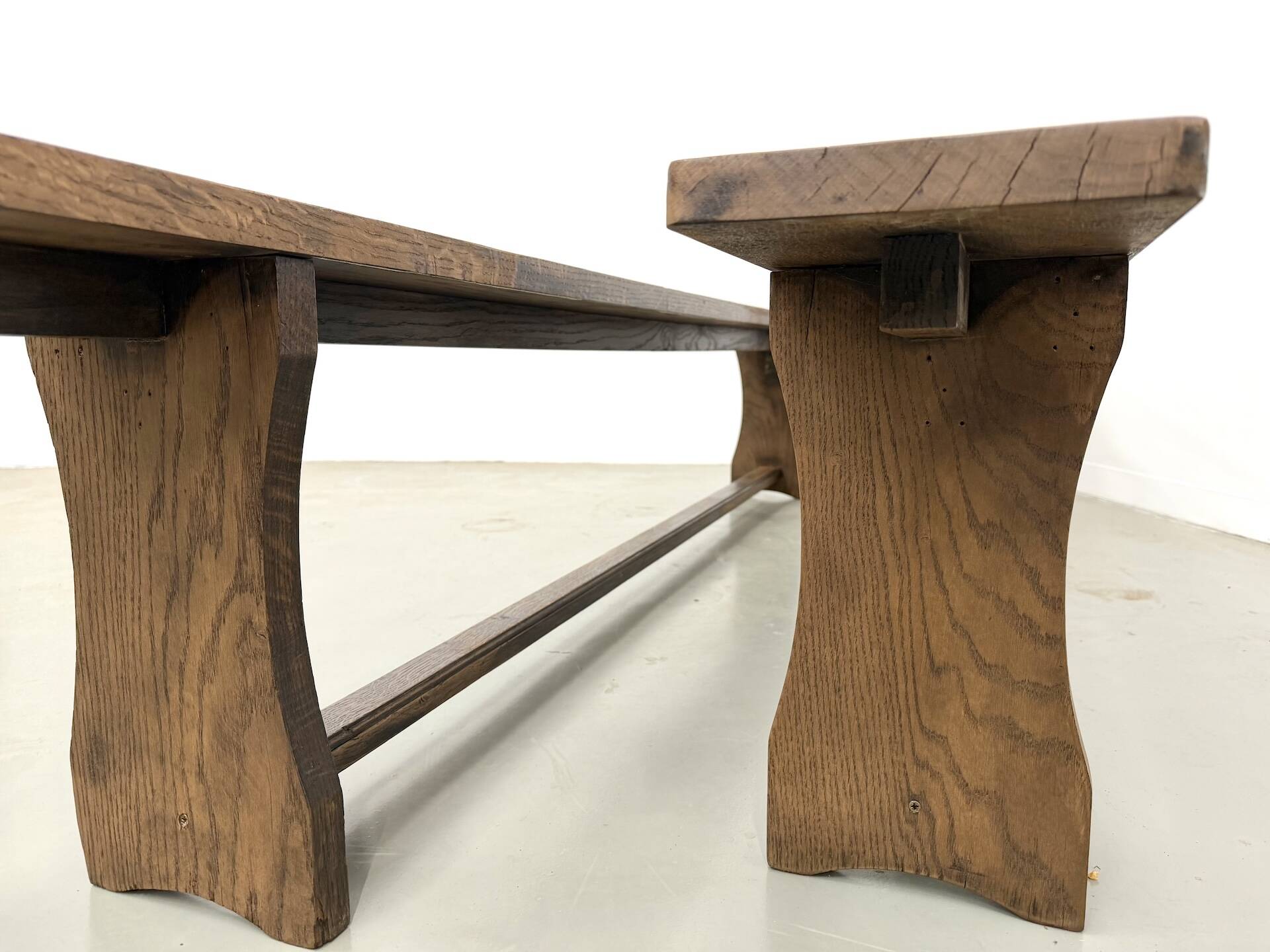 Pair of solid oak benches, winged legs, France, 1970s