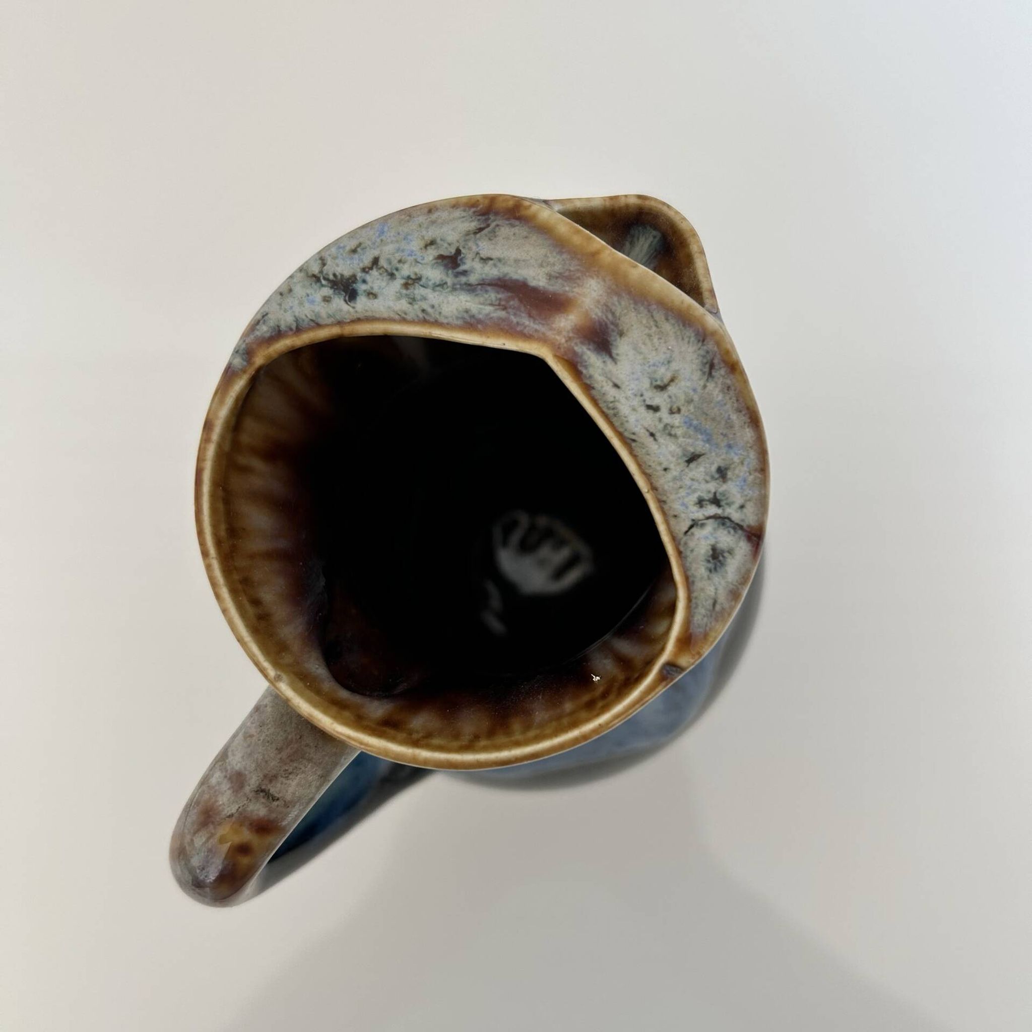 Flamed blue tripod jug