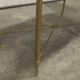 Marble coffee table with brass legs, height 46 cm.