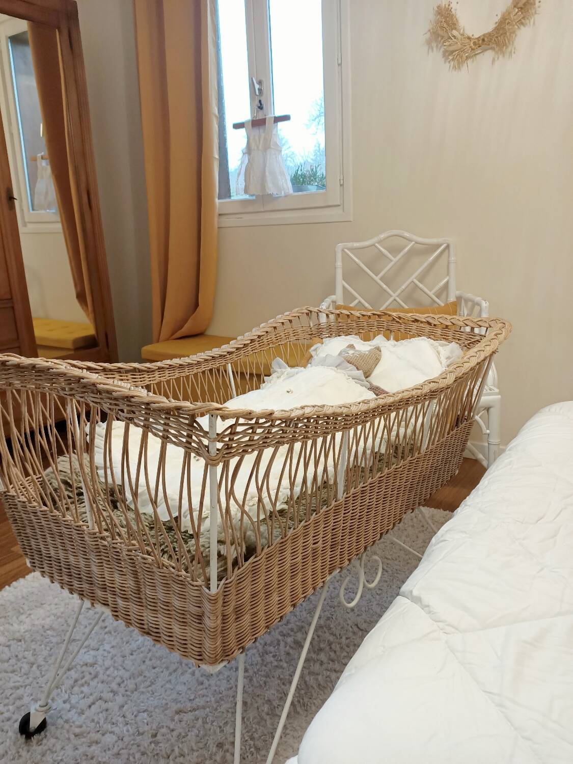 Rattan and wrought iron cradle