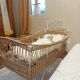 Rattan and wrought iron cradle