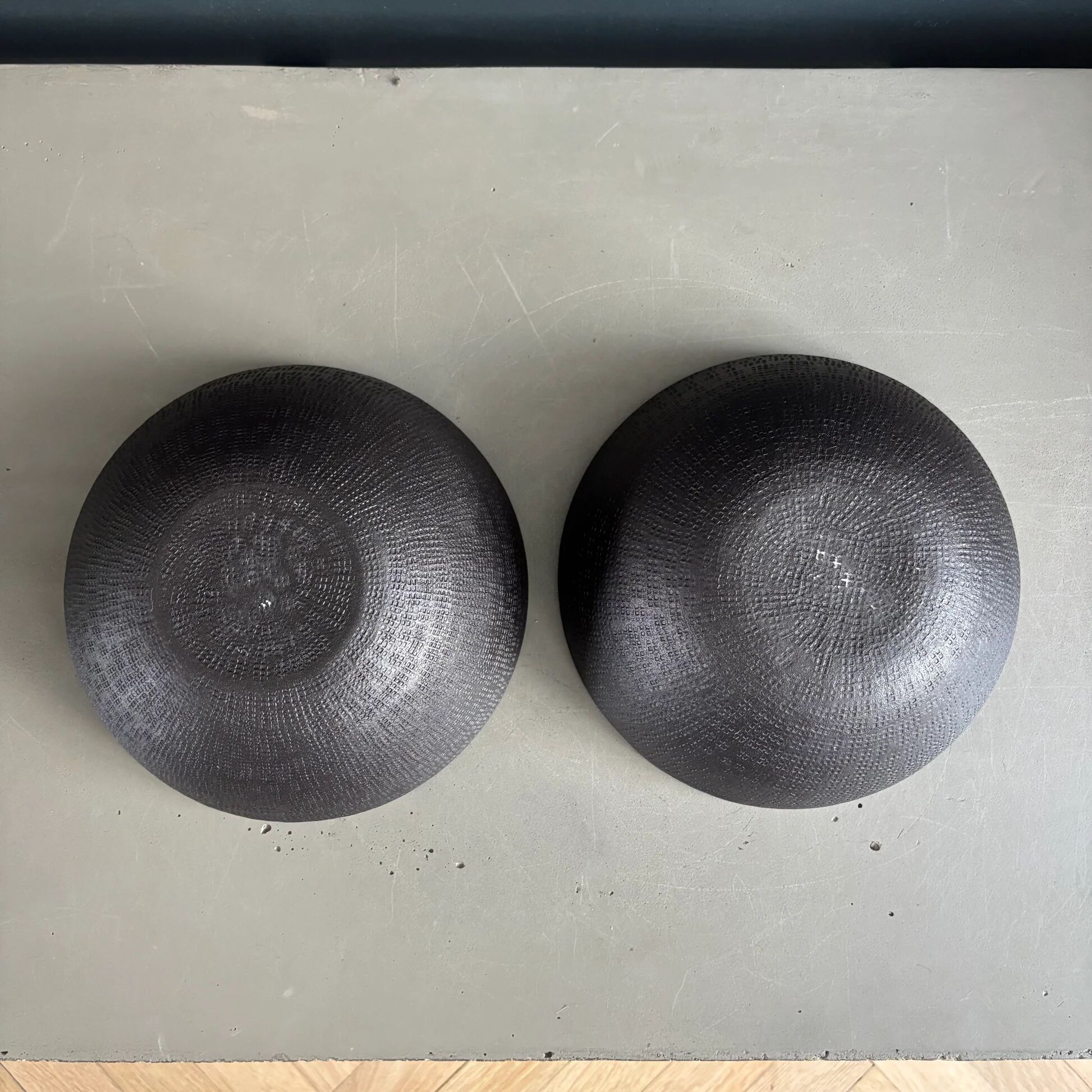 Pair of black lacquered metal catchall bowls