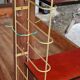 Gold metal wall shelf