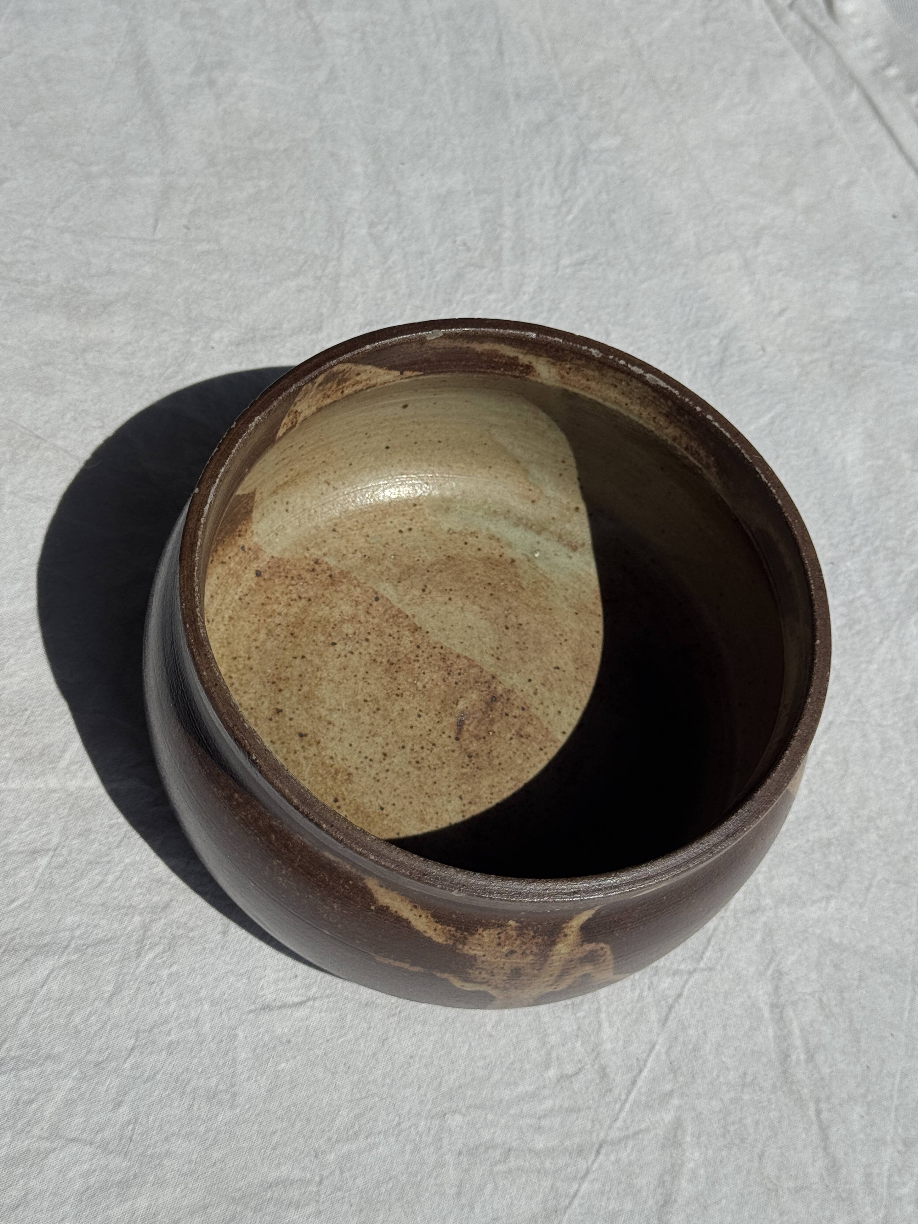 A small stoneware bowl, brown exterior, speckled grey interior D15
