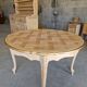 Round table made of cherry wood, sanded and varnished.