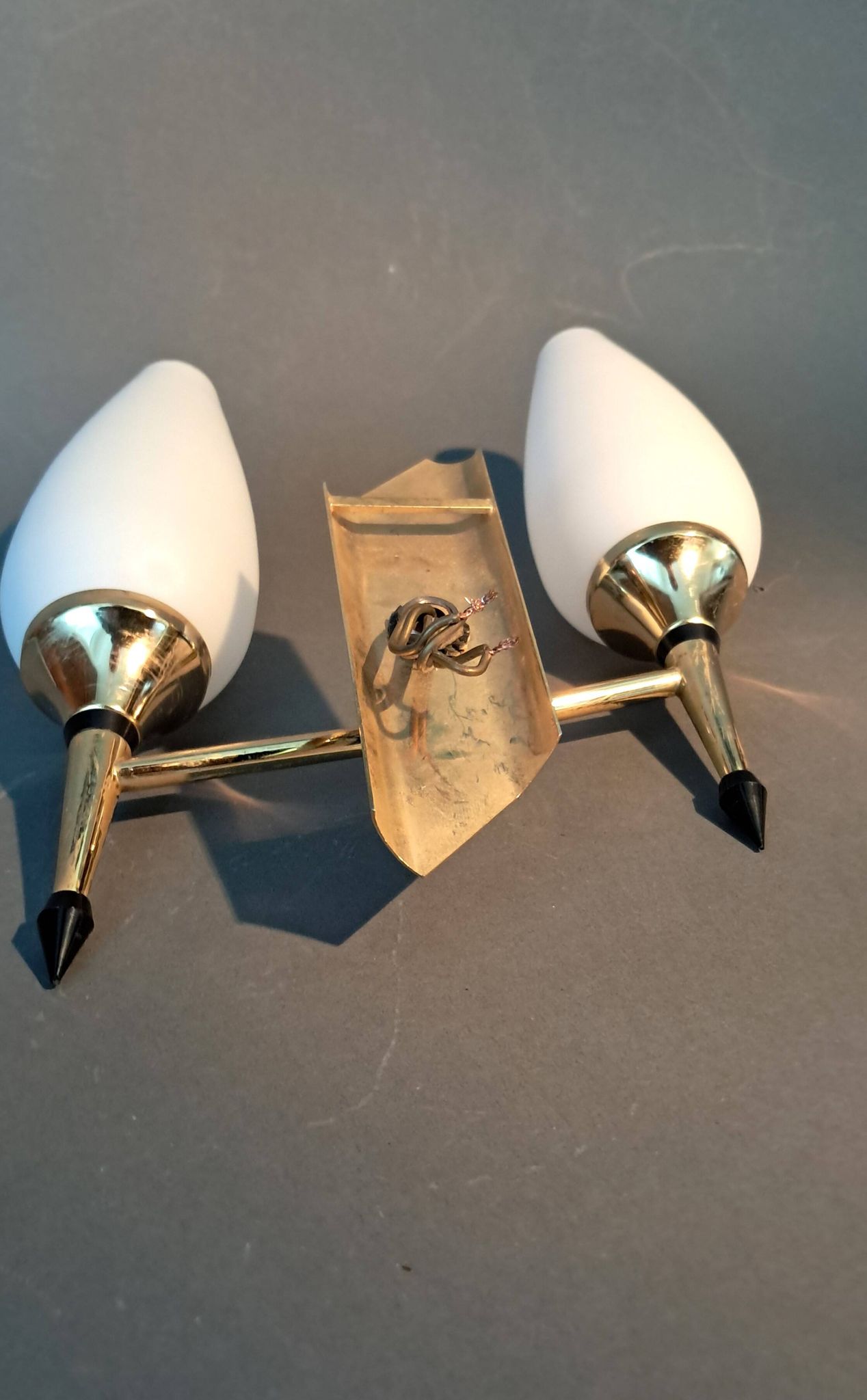 Small two-light wall lamp, white opaline and gilded brass, Circa 1960.