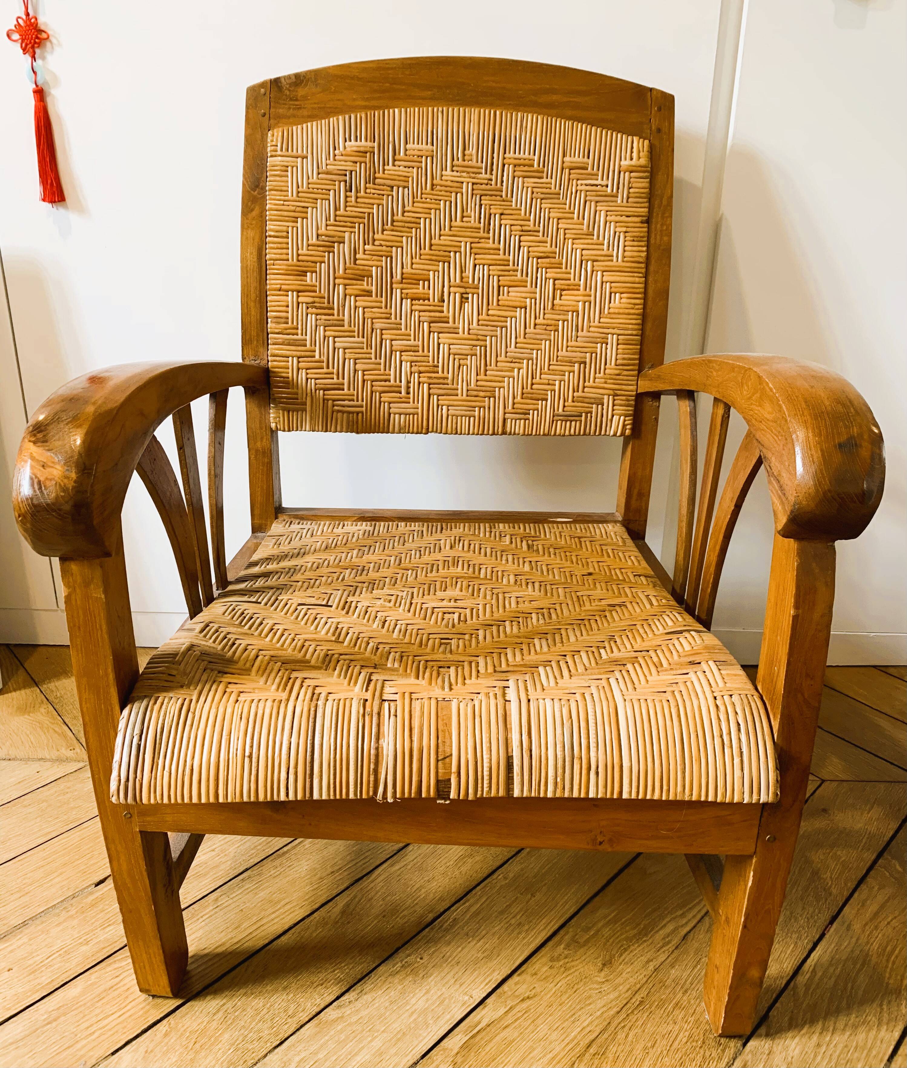 Two contemporary teak and rattan armchairs