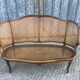 Antique Louis XV bench in solid walnut and caning