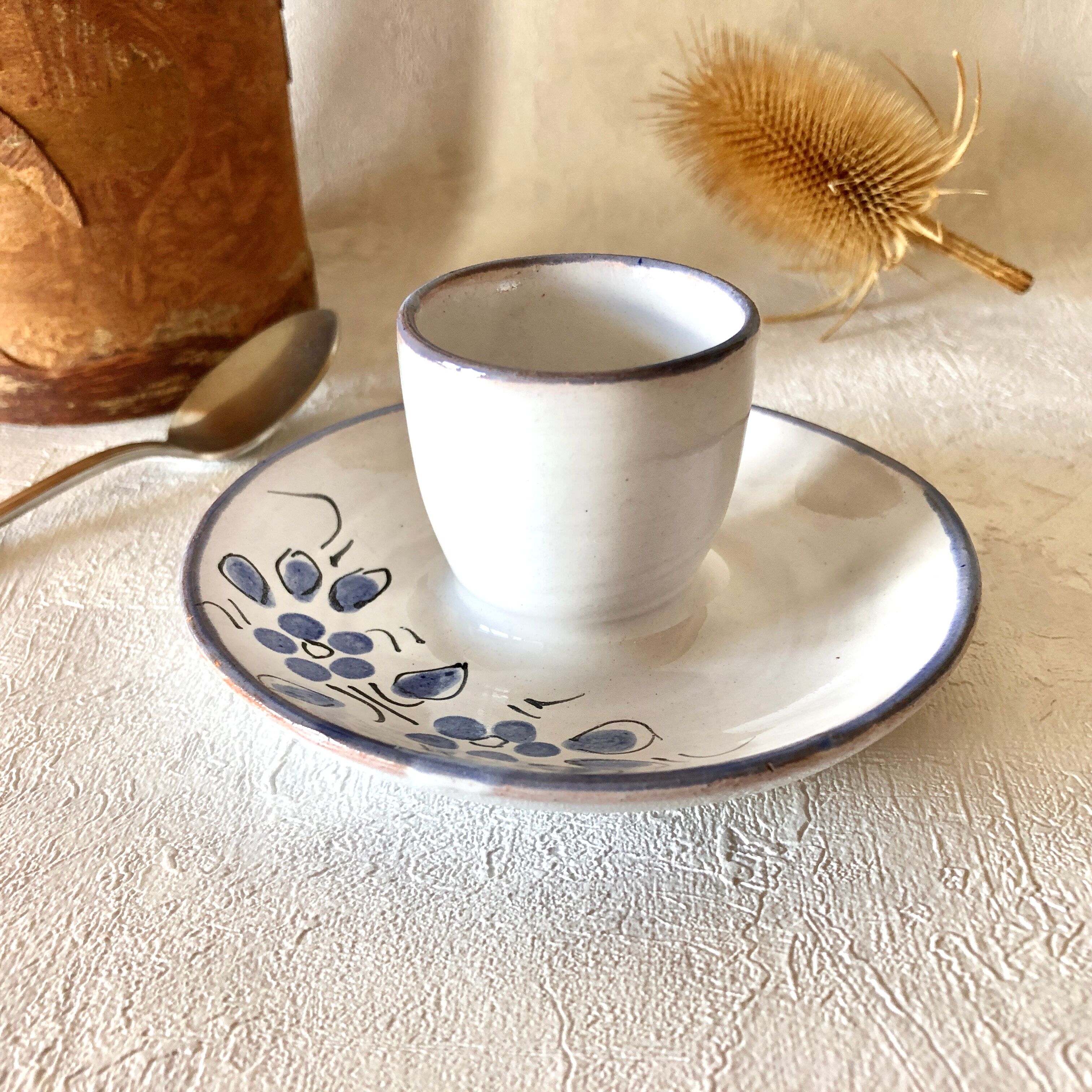 Glazed ceramic shell with painted floral decoration