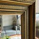 Large antique beveled mirror in the Napoleon III style - Gold and black frame