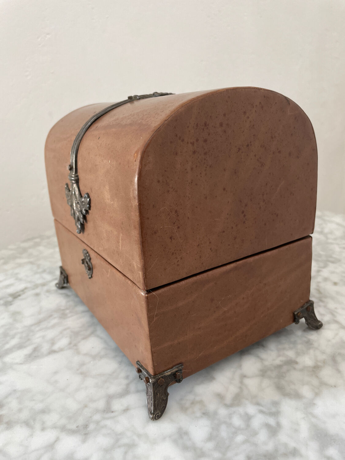 Vintage leather and silver metal jewelry box.