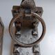 Medieval-style bookends, antique door handle.