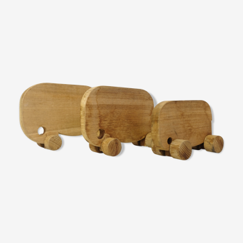 Set of three wooden elephants on wheels