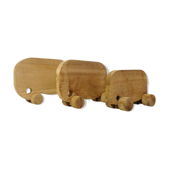 Set of three wooden elephants on wheels
