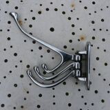 Wall-mounted coat rack in chromed metal with 4 adjustable hooks