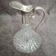 Glass and silver metal wine carafe