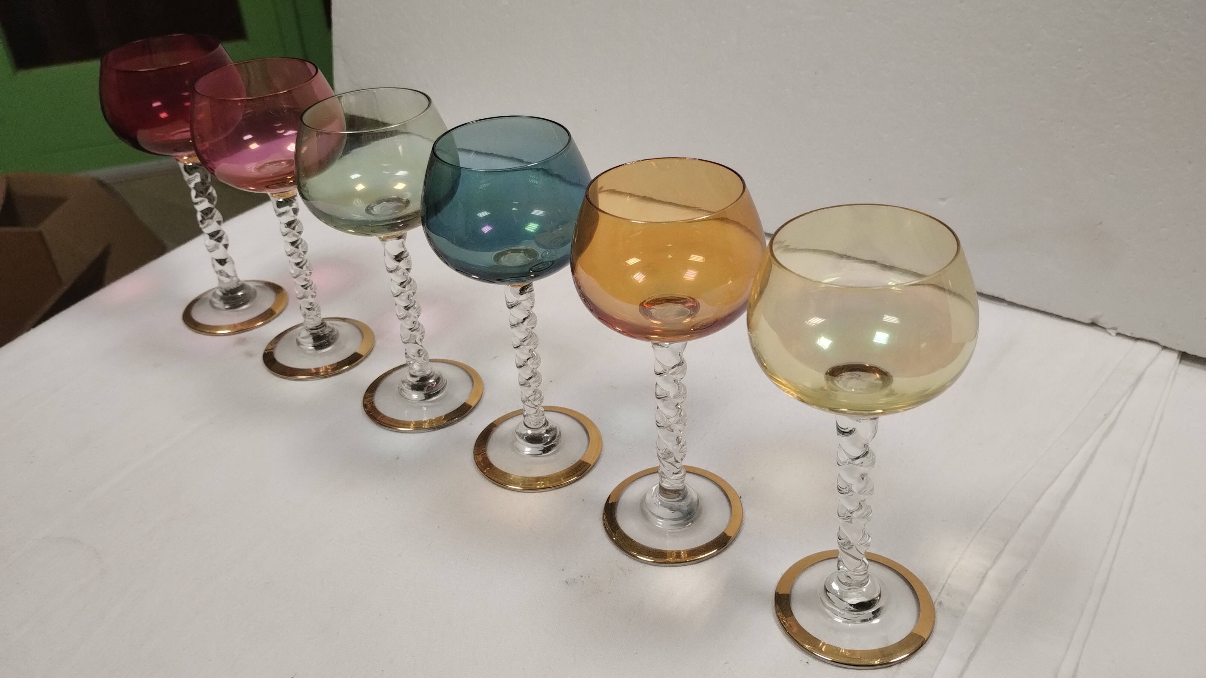 Set of 6 colored crystal stemmed glasses with gold twisted foot.