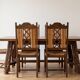 Dining table set with 6 chairs in cherry wood.