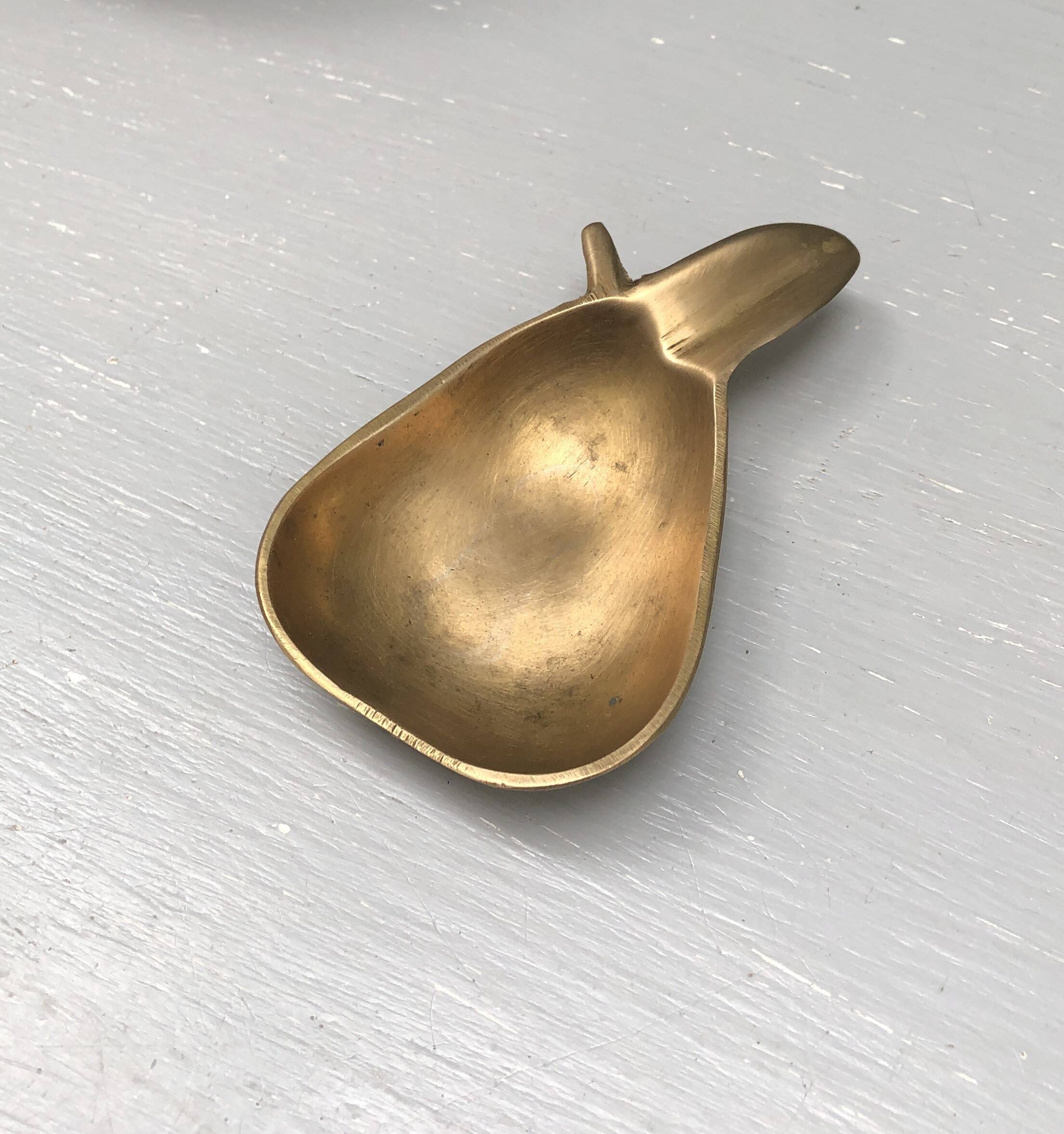 Vintage brass ashtray in the shape of a fruit, pear