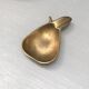 Vintage brass ashtray in the shape of a fruit, pear