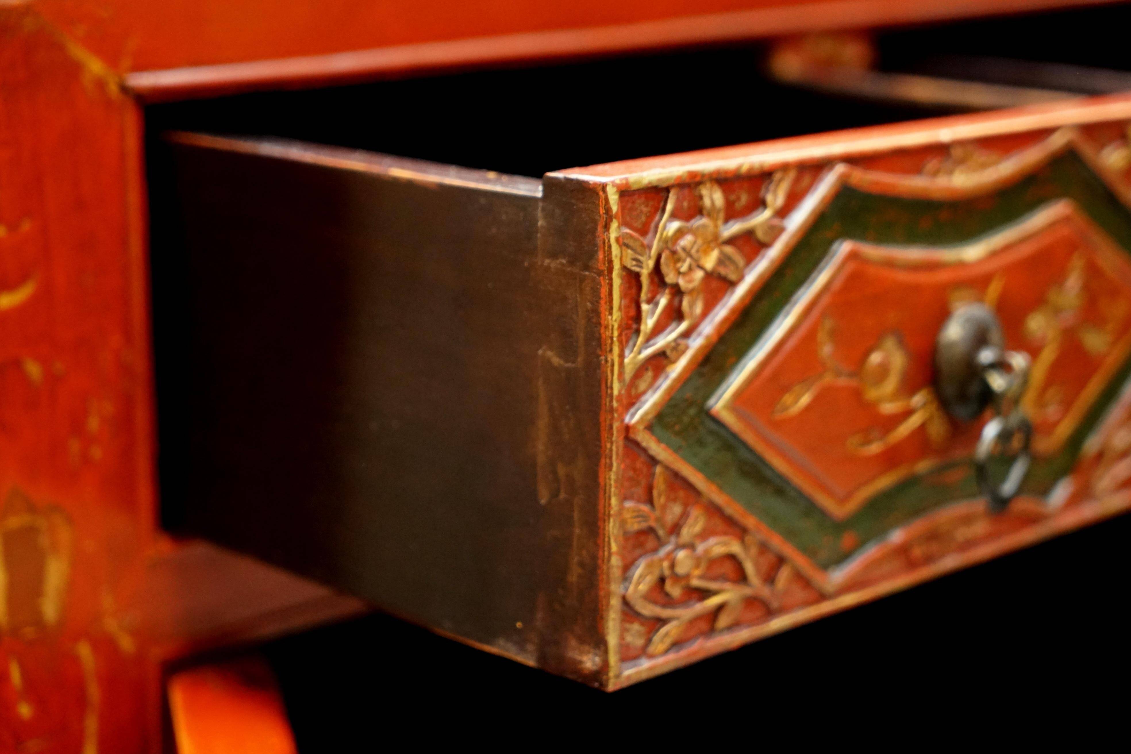 Vintage Chinese lacquered buffet decorated with gold leaf.