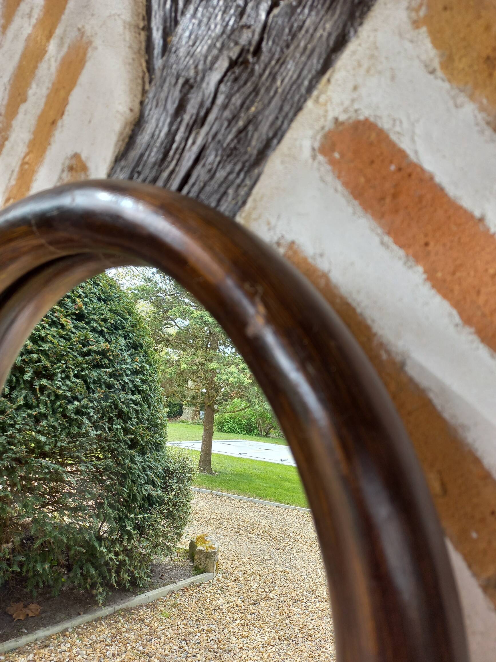 Vintage curved bamboo mirror