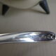 Angora tripod and silver metal spoon