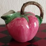 Pink pitcher in the shape of a strawberry, Italian slurry.
