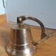Wall entrance bell with bracket