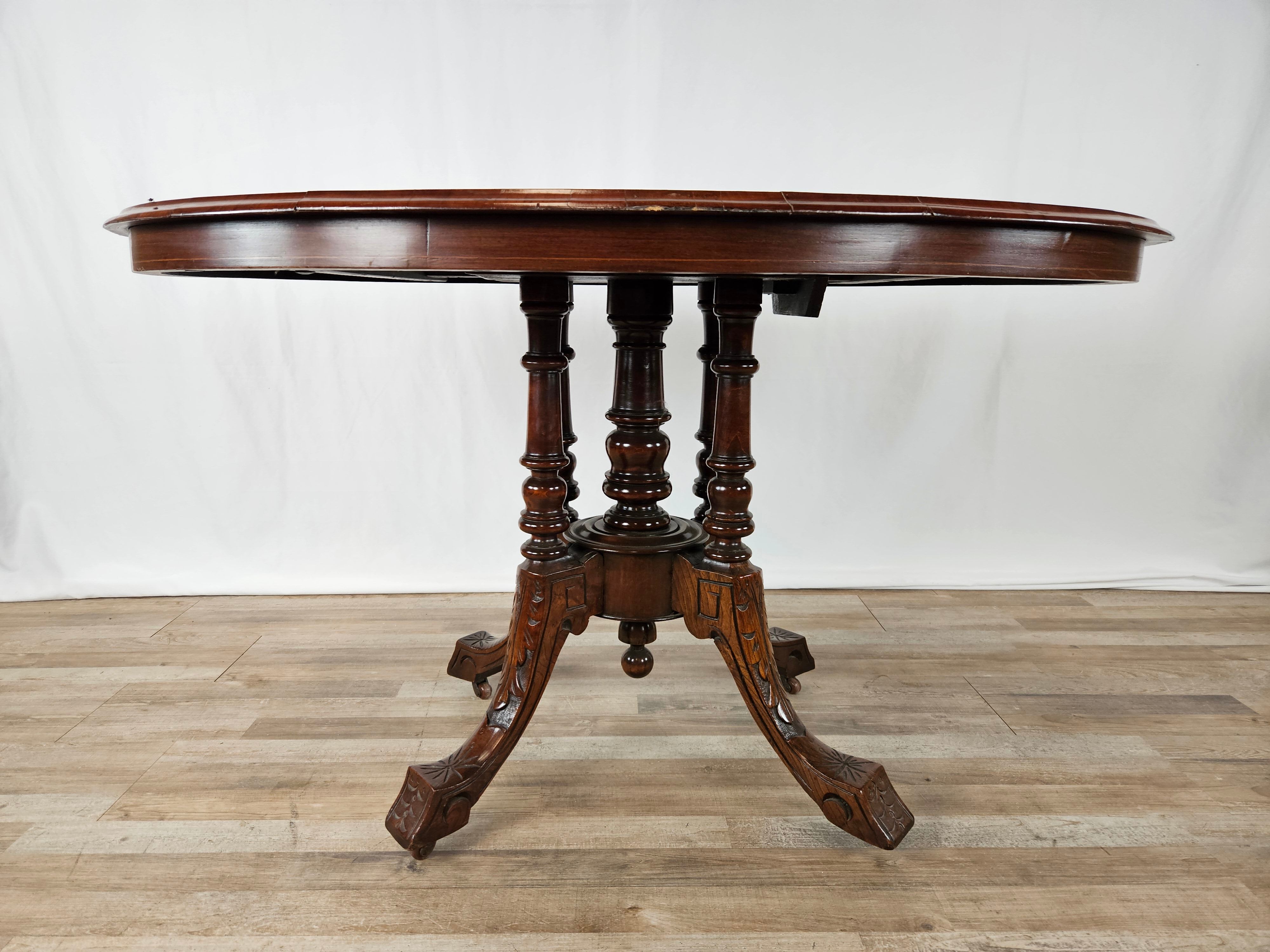 Coffee table in walnut with maple inlays and wheels
