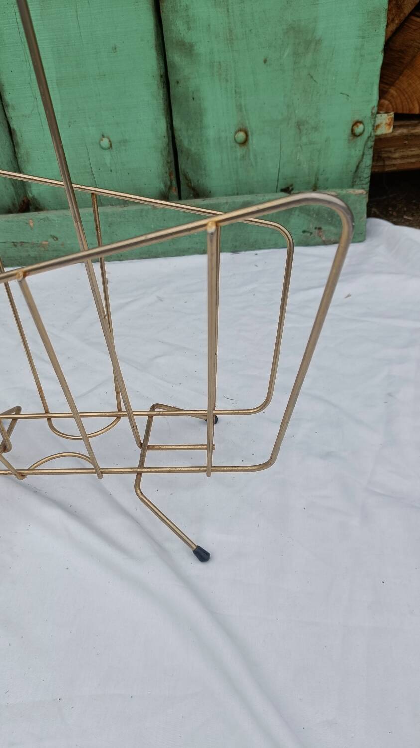Vintage magazine rack in golden brass