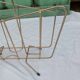Vintage magazine rack in golden brass