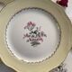 6 antique cream-coloured earthenware dinner plates with gold decoration and flowers.