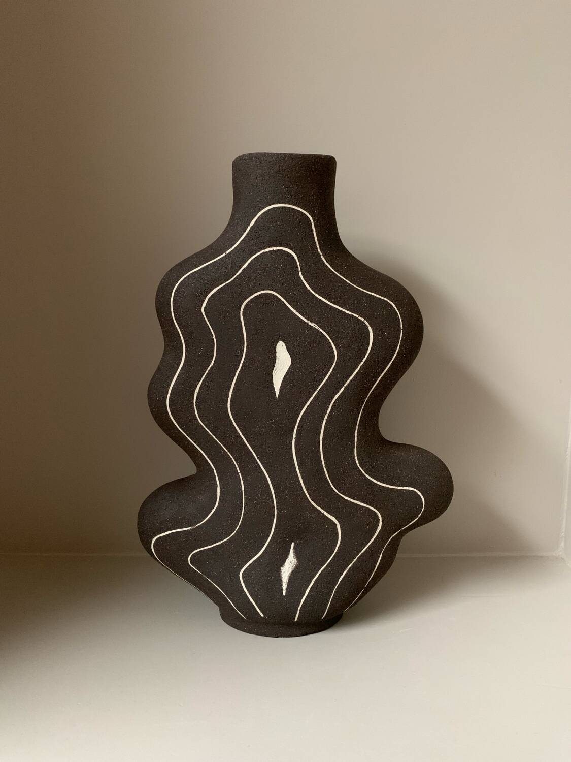 Raw black stoneware vase